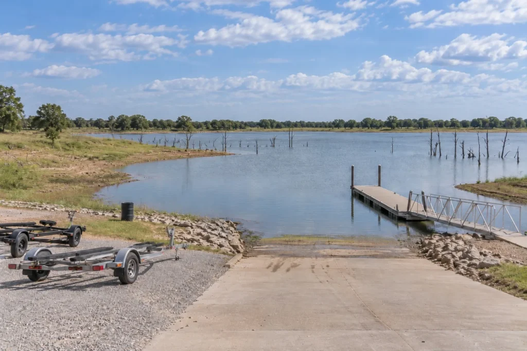 Public boat ramp and courtesy dock on a Northeast Texas reservoir with standing timber
