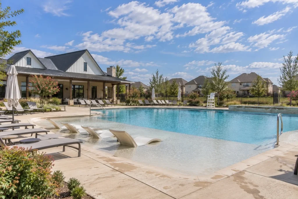 Resort-style amenity pool and farmhouse-style clubhouse in a North Texas master-planned community