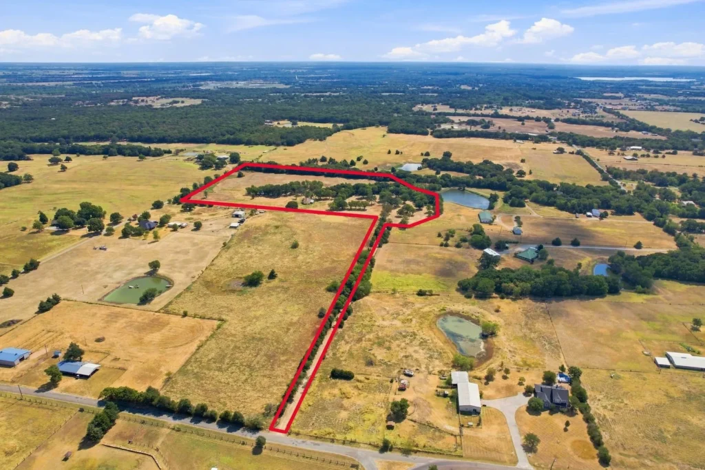 Aerial view of a fenced rural tract — the first look I take at any Fannin County land