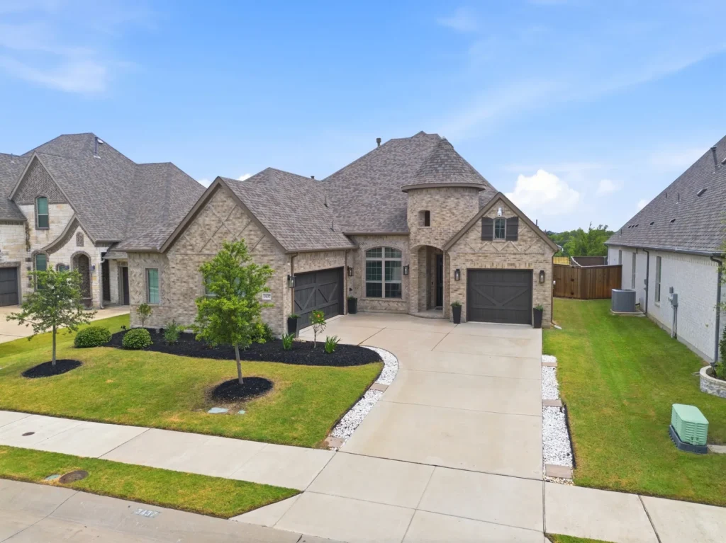 A stone and brick two-story home listed by Shayla Eadler