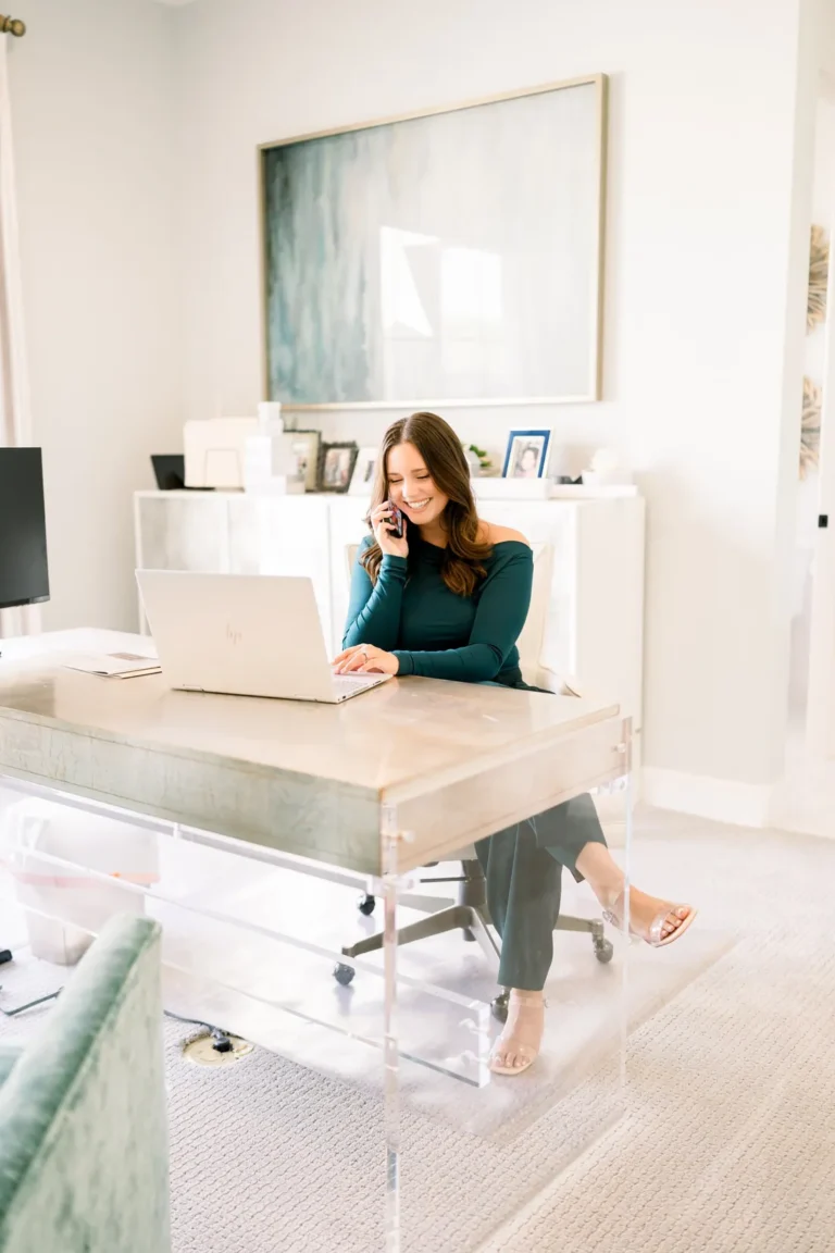 Shayla Eadler at her desk, writing for her North Texas real estate blog